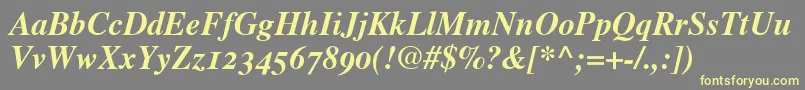 TimesBoldItalicOldStyleFigures-fontti – keltaiset fontit harmaalla taustalla