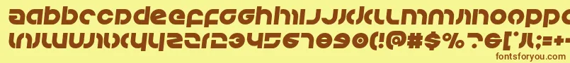フォントKovacssemital – 茶色の文字が黄色の背景にあります。