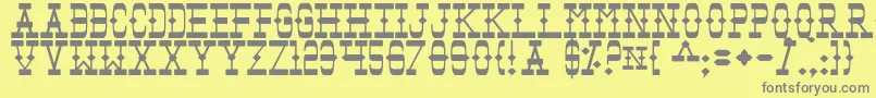 Tomb-fontti – harmaat kirjasimet keltaisella taustalla