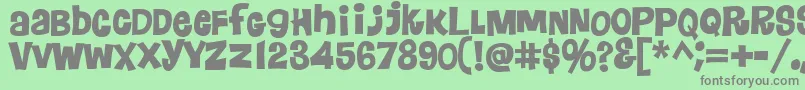 フォントFloraless – 緑の背景に灰色の文字