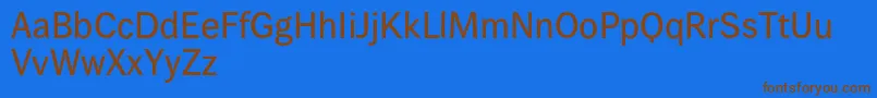 Wendelinreduced65kraeftig-Schriftart – Braune Schriften auf blauem Hintergrund