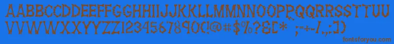 FossilRegular Font – Brown Fonts on Blue Background