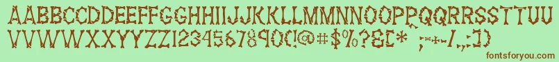 FossilRegular Font – Brown Fonts on Green Background