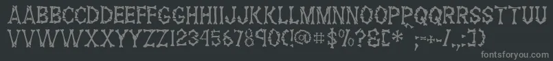 FossilRegular Font – Gray Fonts on Black Background