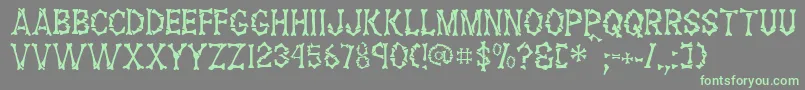 FossilRegular Font – Green Fonts on Gray Background