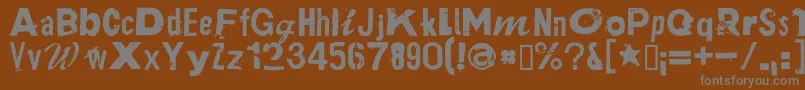 フォントPlakkenRegular – 茶色の背景に灰色の文字