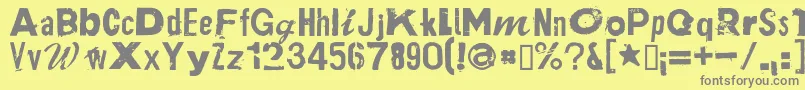 PlakkenRegular-fontti – harmaat kirjasimet keltaisella taustalla