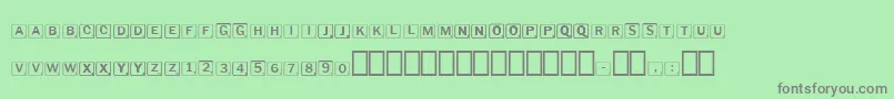 Scrabbles-Schriftart – Graue Schriften auf grünem Hintergrund