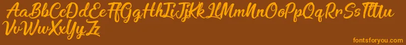 EnchantingCelebrations Font – Orange Fonts on Brown Background