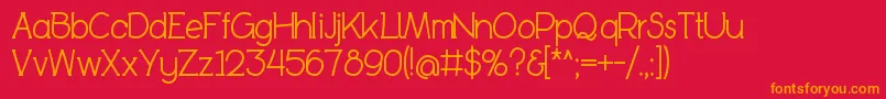 フォントBookietasticRegular – 赤い背景にオレンジの文字