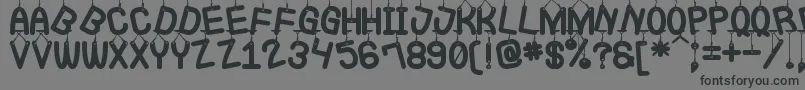 LaQueCuelgaSt Font – Black Fonts on Gray Background