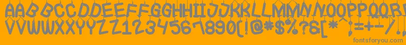 LaQueCuelgaSt-Schriftart – Graue Schriften auf orangefarbenem Hintergrund