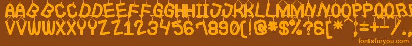 LaQueCuelgaSt Font – Orange Fonts on Brown Background