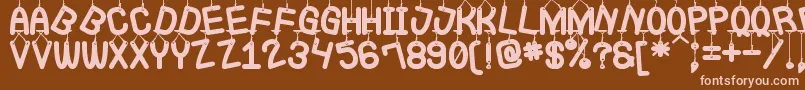 LaQueCuelgaSt Font – Pink Fonts on Brown Background