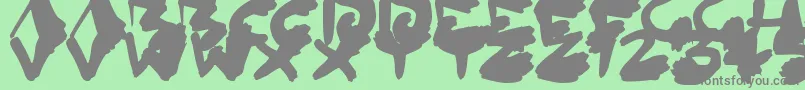 Więcej informacji o czcionce InkedOut Czcionka InkedOut – szare czcionki na zielonym tle