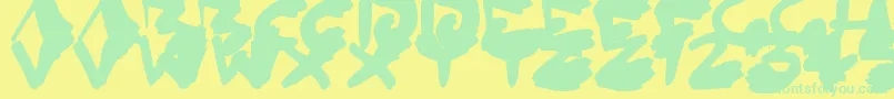 InkedOut Font – Green Fonts on Yellow Background