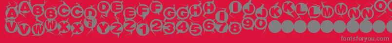 フォントMachinegun – 赤い背景に灰色の文字