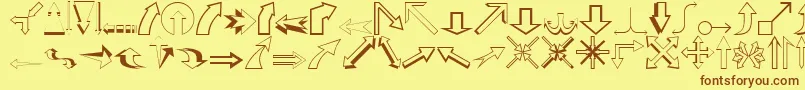 フォントCarrArrowsOutline – 茶色の文字が黄色の背景にあります。