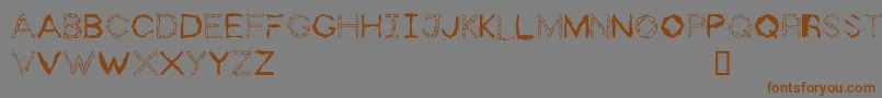 Fonte ZhollyDisplay – fontes marrons em um fundo cinza