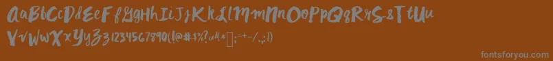 Mixkitsch-Schriftart – Graue Schriften auf braunem Hintergrund