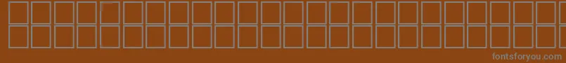 Шрифт AlHosamOutline – серые шрифты на коричневом фоне