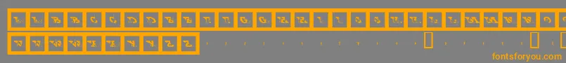 フォントBigftcp – オレンジの文字は灰色の背景にあります。