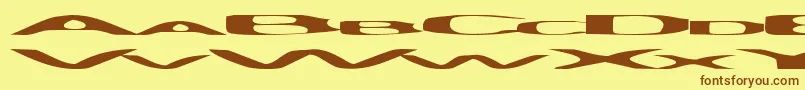 フォントPsychye – 茶色の文字が黄色の背景にあります。
