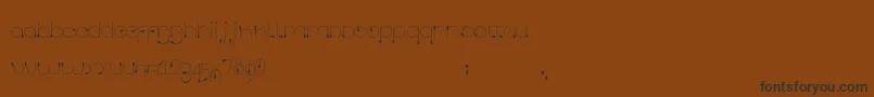 Tropfen Font – Black Fonts on Brown Background