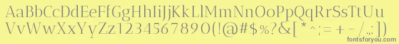 AnticdidoneRegular-Schriftart – Graue Schriften auf gelbem Hintergrund