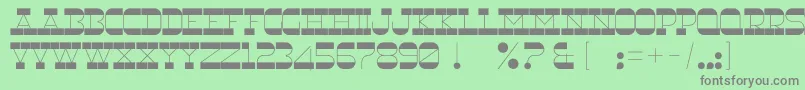 RnsUnderwood-fontti – harmaat kirjasimet vihreällä taustalla
