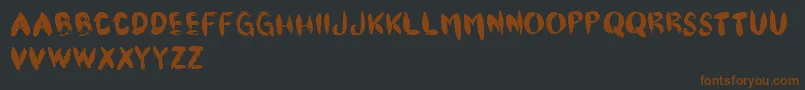 Czcionka Cfpinceau – brązowe czcionki na czarnym tle