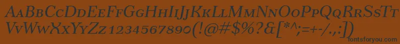 Czcionka TusarscItalic – czarne czcionki na brązowym tle
