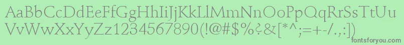 StempelSchneidlerLtLight-Schriftart – Graue Schriften auf grünem Hintergrund