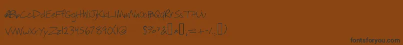 フォントWillyjhandwriting – 黒い文字が茶色の背景にあります