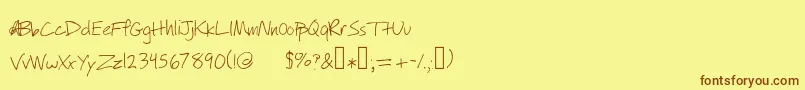 フォントWillyjhandwriting – 茶色の文字が黄色の背景にあります。