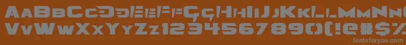 Angolmois-fontti – harmaat kirjasimet ruskealla taustalla