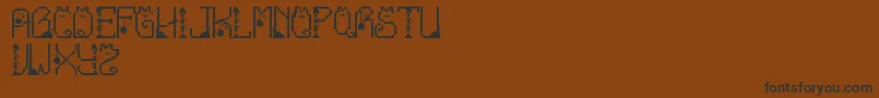 Шрифт LmsCatTreats – чёрные шрифты на коричневом фоне