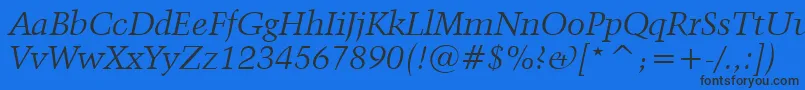 Kuenstler480ItalicBt Font – Black Fonts on Blue Background