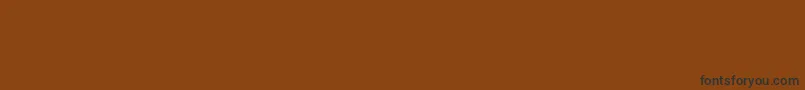 Czcionka Borderfontclassicals – czarne czcionki na brązowym tle