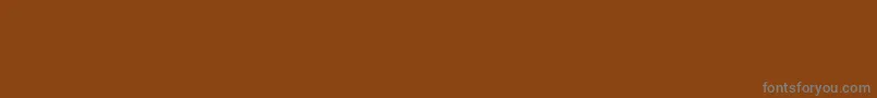 Czcionka Borderfontclassicals – szare czcionki na brązowym tle