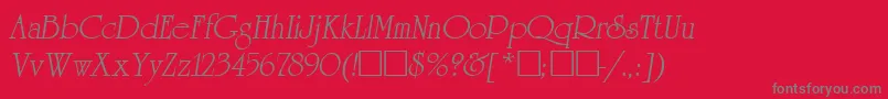 ReverenceLihgtItalic-fontti – harmaat kirjasimet punaisella taustalla