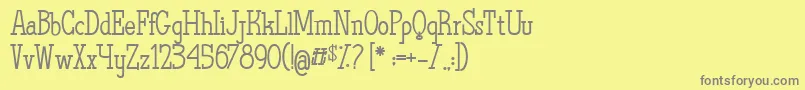 TheQuestOfDiscoveries-Schriftart – Graue Schriften auf gelbem Hintergrund