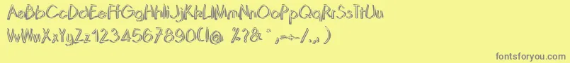 フォントDominoRegular – 黄色の背景に灰色の文字