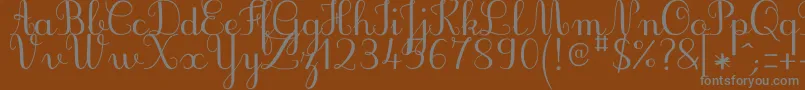 Czcionka JbcursiveV3Medium – szare czcionki na brązowym tle