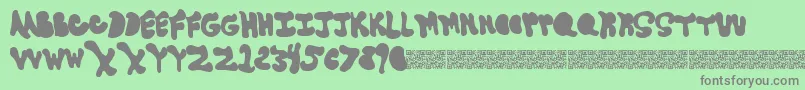 Goneaway-fontti – harmaat kirjasimet vihreällä taustalla