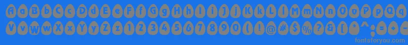 フォントEggsblackBecker – 青い背景に灰色の文字