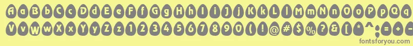 EggsblackBecker-fontti – harmaat kirjasimet keltaisella taustalla