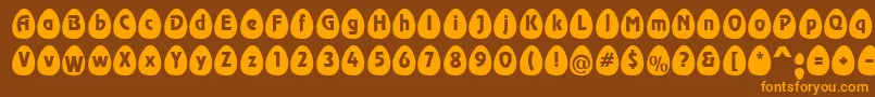 EggsblackBecker-fontti – oranssit fontit ruskealla taustalla