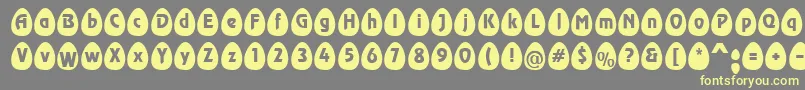 EggsblackBecker-fontti – keltaiset fontit harmaalla taustalla