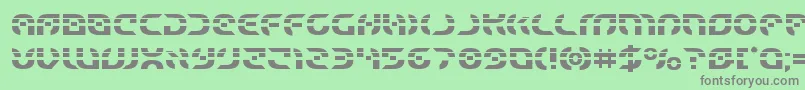 フォントStarfighterlaser – 緑の背景に灰色の文字